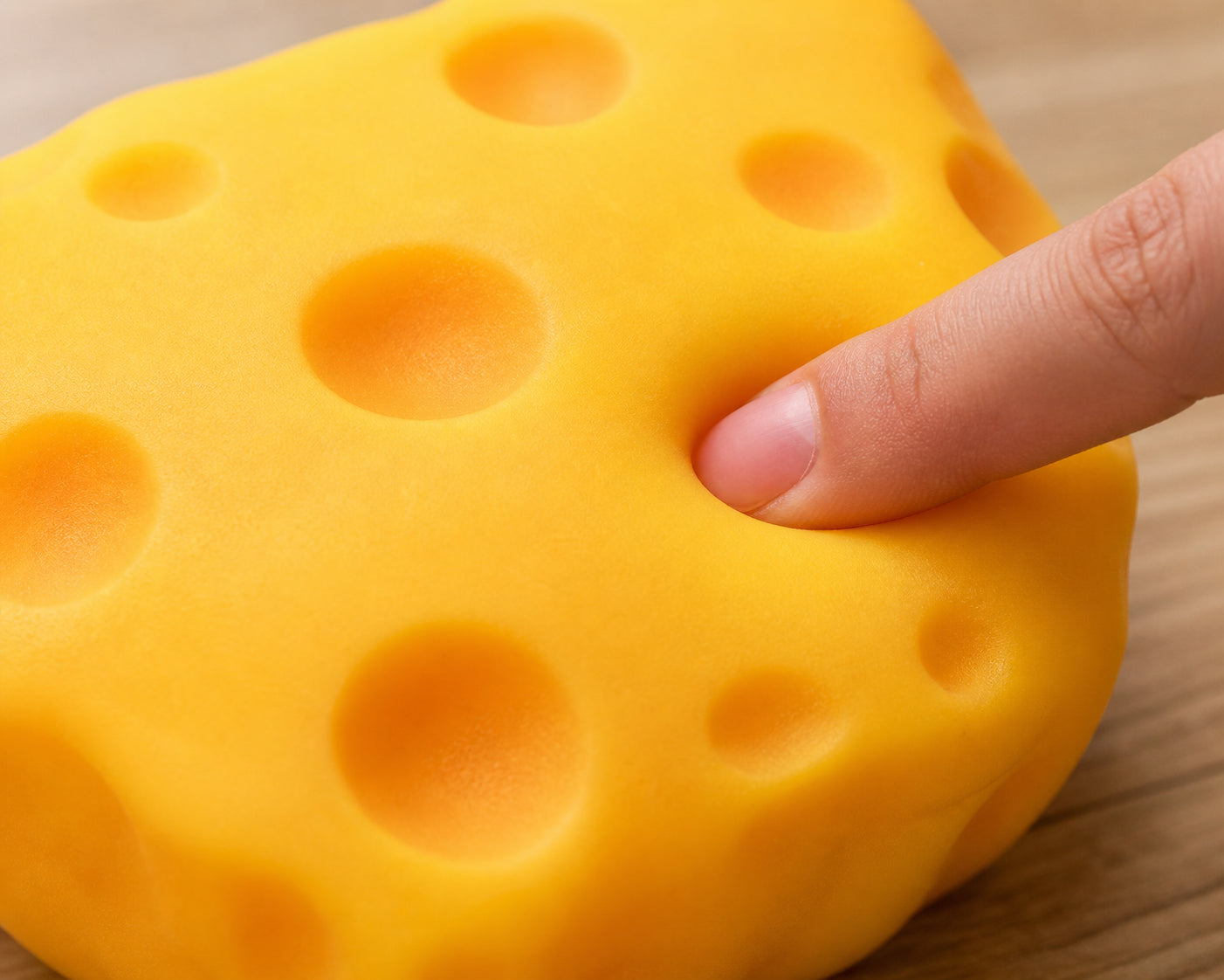 Macro texture of cheese squeeze toy dimples