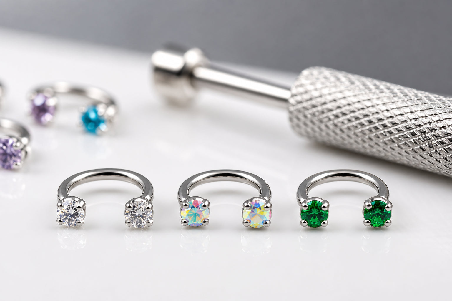 Macro detail of crystal nose rings and tool